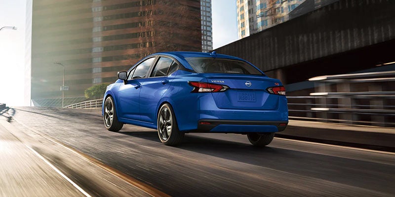 Nissan Versa running on windy road
